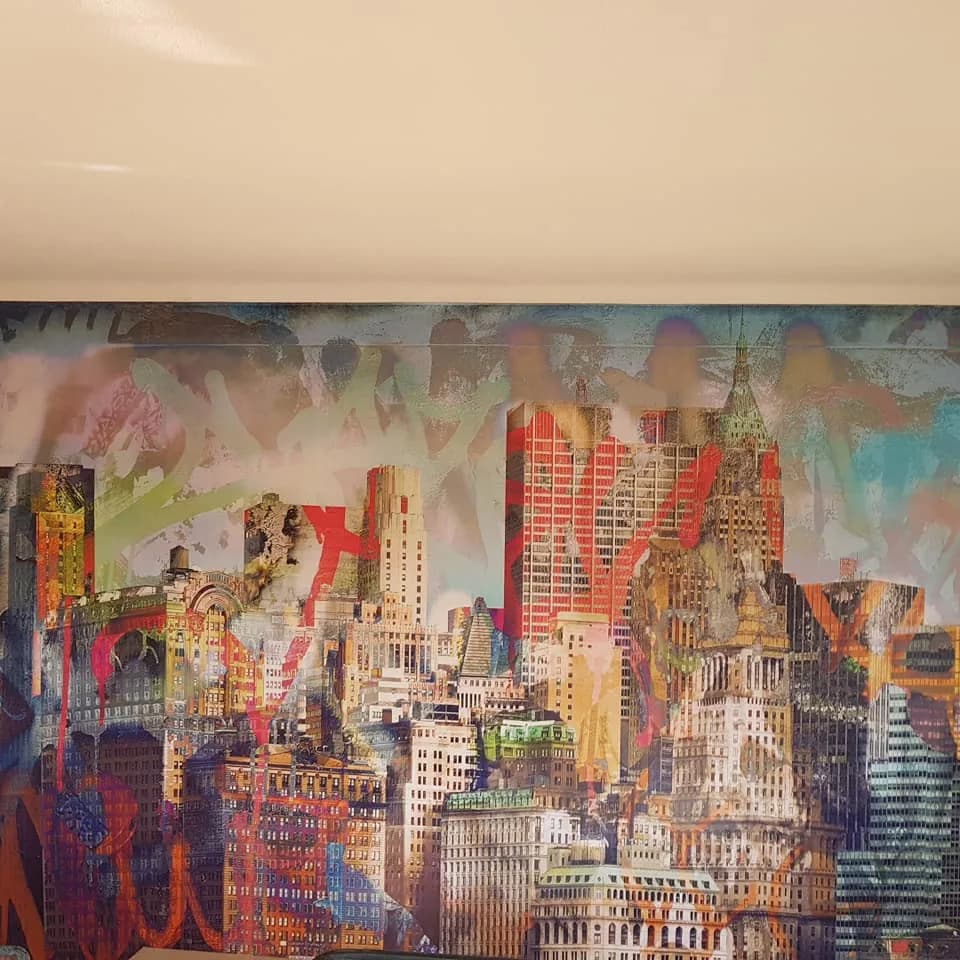 New York skyline feature mural filling a living room wall