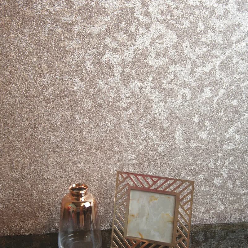 Metallic textured wallpaper catching the light behind a framed print
