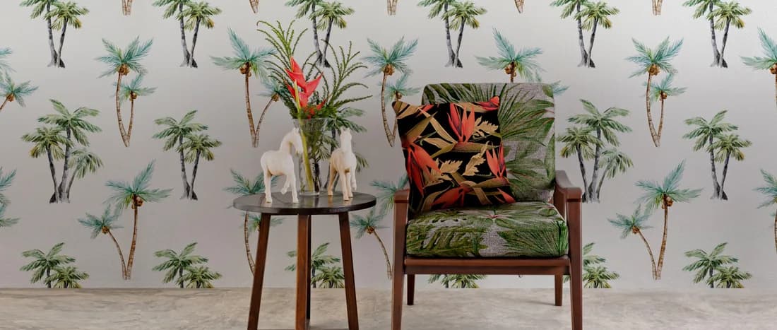Palm-print wallpaper in a light room with a single armchair